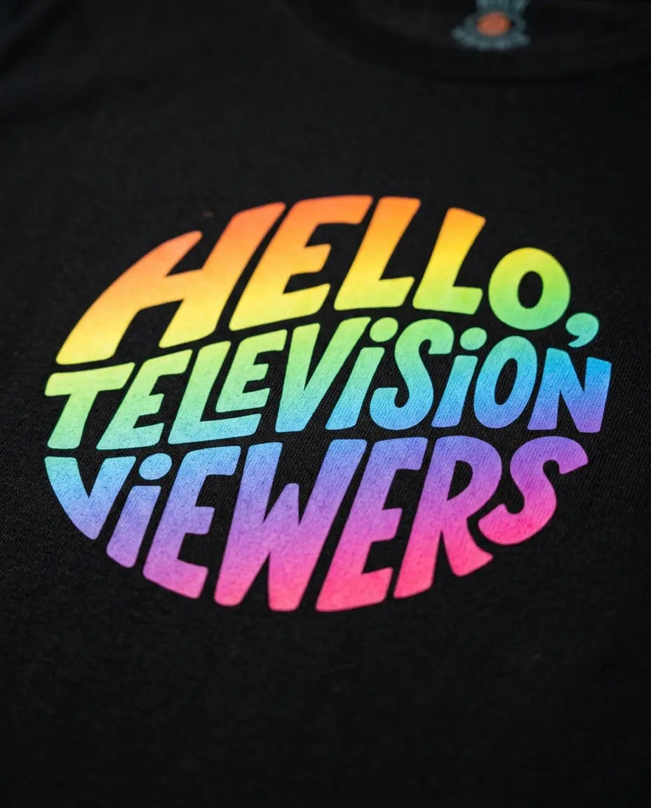 Close-up of rainbow artwork printed on the Black T-shirt