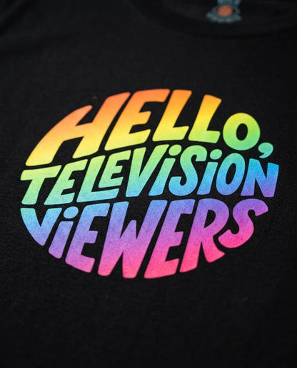 Close-up of rainbow artwork printed on the Black T-shirt
